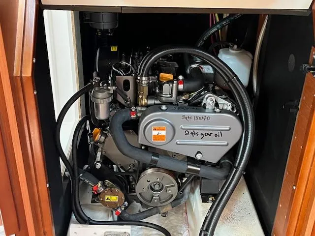 Nansea I Yacht Photos Pics Engine compartment of a 2017 Beneteau Oceanis 38.1 sailboat, showcasing detailed mechanical components.