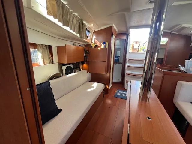 Nansea I Yacht Photos Pics Interior of 2017 Beneteau Oceanis 38.1 yacht with modern wood finish and cozy seating.