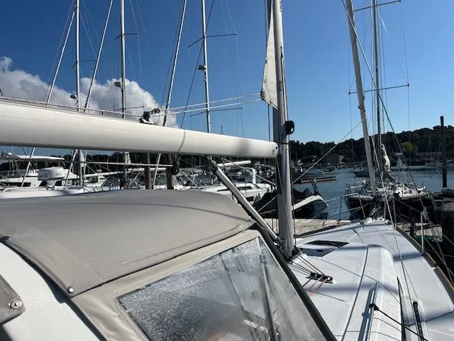 Nansea I Yacht Photos Pics Sailboat Beneteau Oceanis 38.1, 2017 model, docked in a marina under clear blue skies.