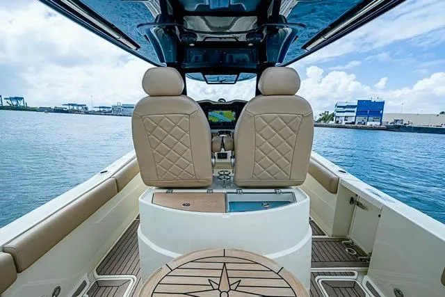  Yacht Photos Pics 2019 Chris-Craft Catalina 30 boat interior with tan seats and ocean view.