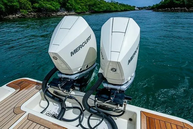  Yacht Photos Pics 2019 Chris-Craft Catalina 30 with twin Mercury outboard engines on a scenic waterway.