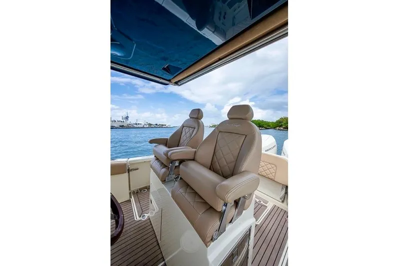  Yacht Photos Pics Luxurious seating on 2019 Chris-Craft Catalina 30 boat, featuring elegant design and waterfront view.