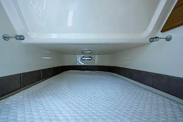  Yacht Photos Pics 2019 Chris-Craft Catalina 30 cabin interior with a comfortable sleeping area.