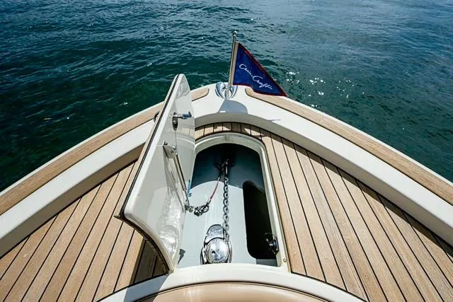  Yacht Photos Pics 2019 Chris-Craft Catalina 30 boat with open anchor hatch and flag on teak deck.