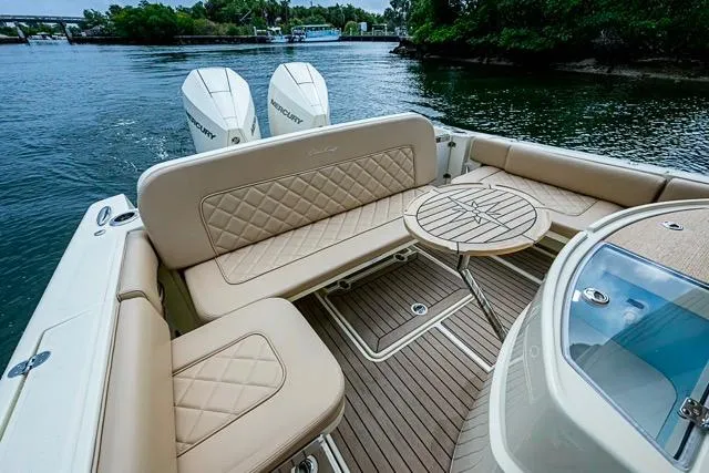  Yacht Photos Pics 2019 Chris-Craft Catalina 30 boat with elegant seating and twin Mercury engines on a serene waterway.