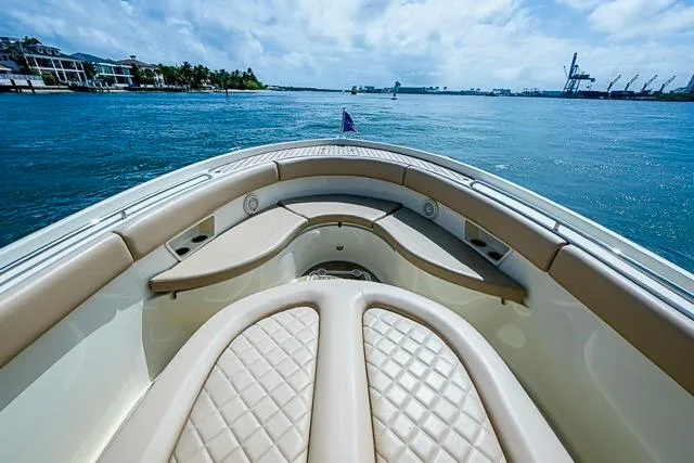  Yacht Photos Pics 2019 Chris-Craft Catalina 30 boat with luxurious seating, cruising on a sunny day.