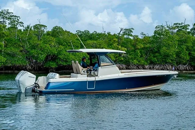  Yacht Photos Pics 2019 Chris-Craft Catalina 30 boat cruising near lush mangroves.