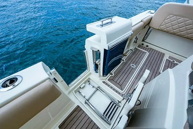  Yacht Photos Pics 2019 Chris-Craft Catalina 30 boat interior with elegant seating and teak flooring.