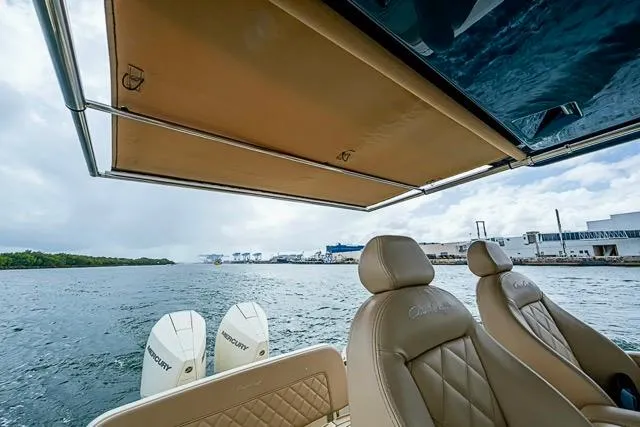  Yacht Photos Pics 2019 Chris-Craft Catalina 30 boat with Mercury engines, featuring luxurious seating and a retractable canopy.
