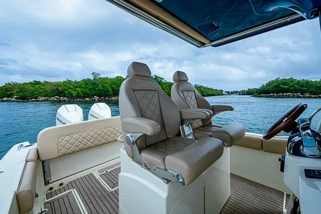  Yacht Photos Pics 2019 Chris-Craft Catalina 30 boat interior with luxurious seating and scenic water view.