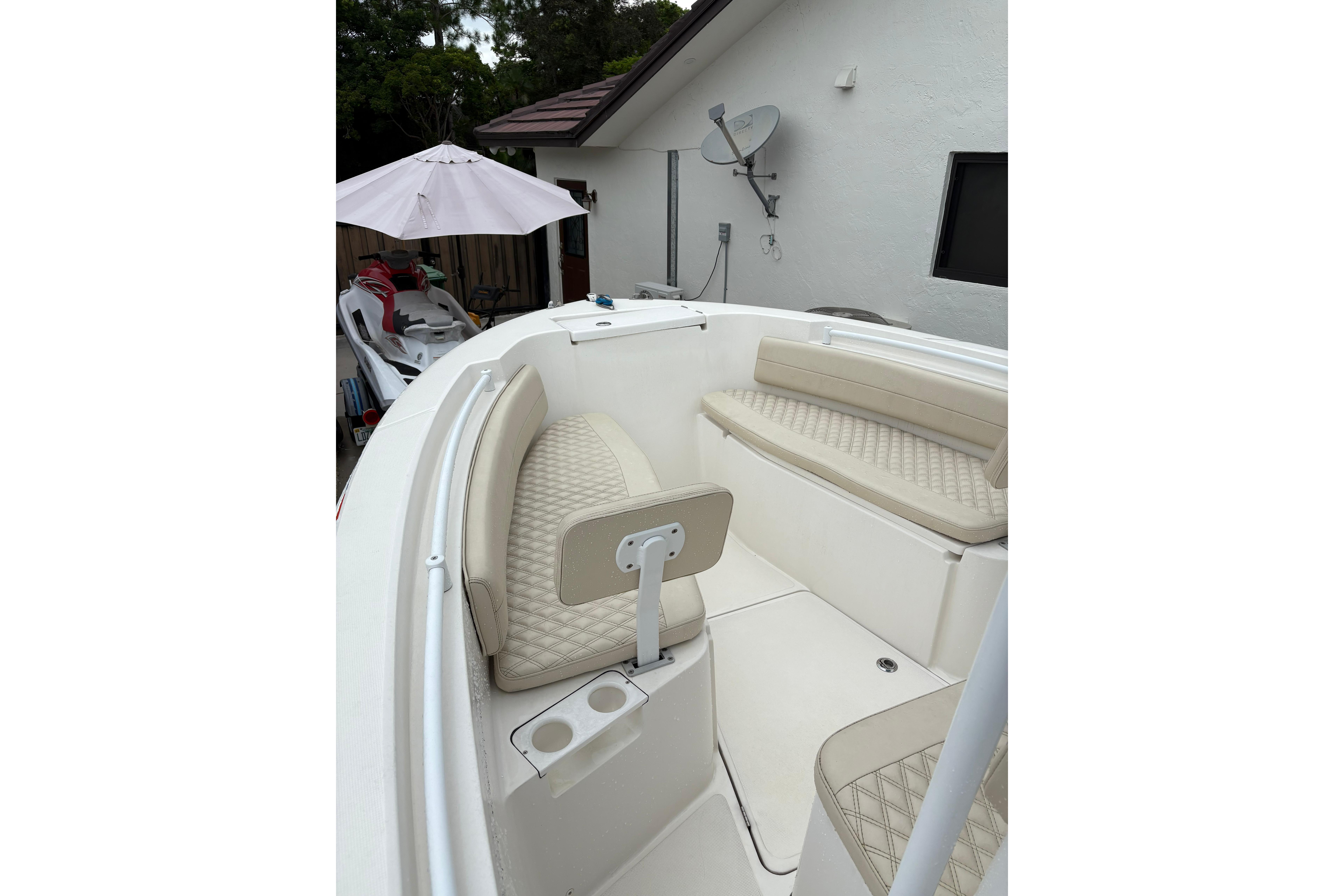 2019 Release 210 RX boat interior with beige seating and cup holders.
