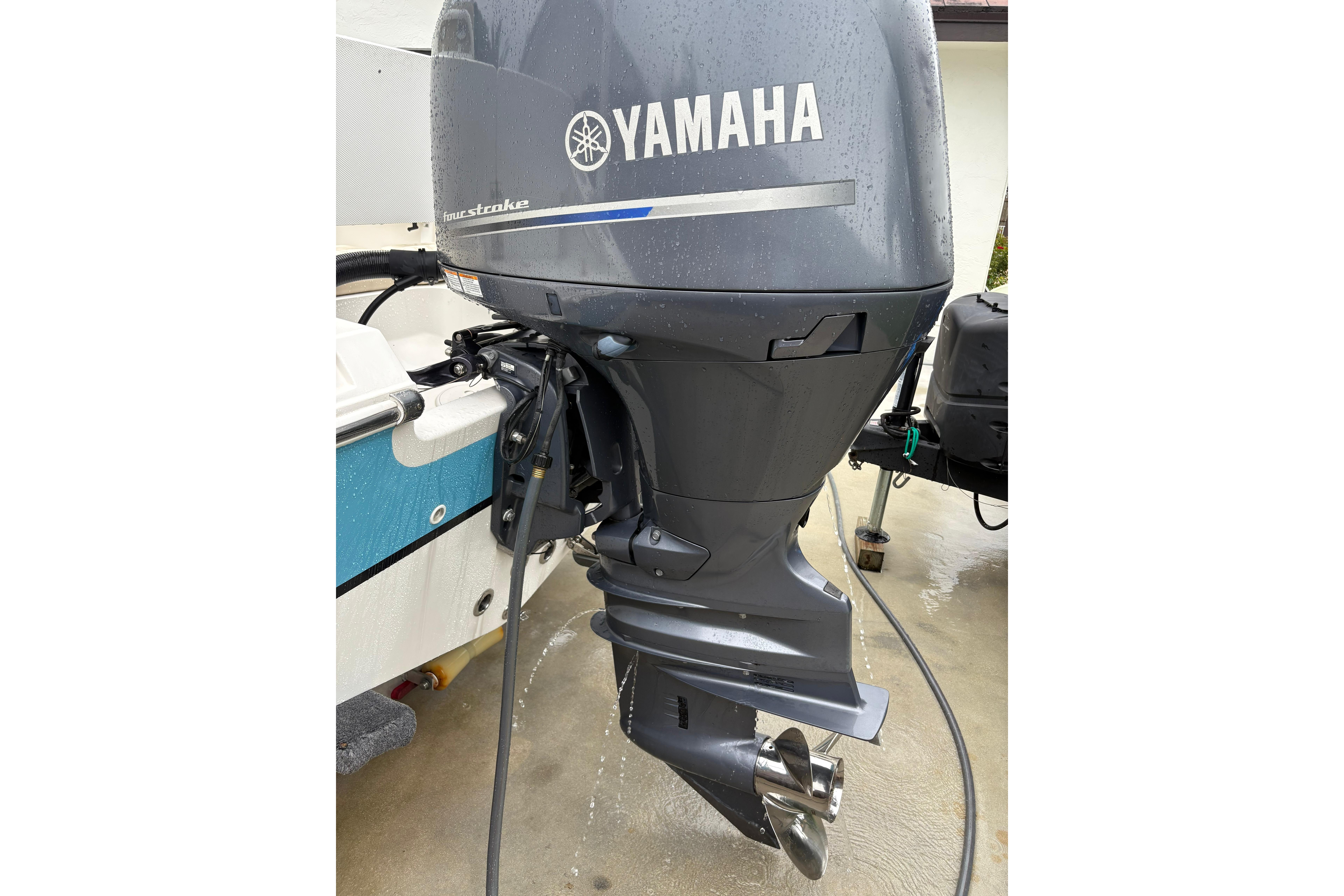 Yamaha outboard motor on 2019 Release 210 RX boat, wet surface.