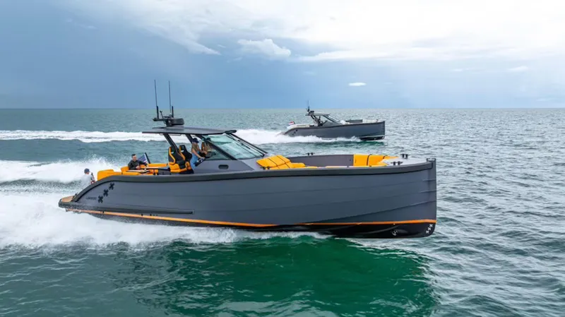  Yacht Photos Pics 2024 Lekker 44 boats cruising on open sea under cloudy sky.