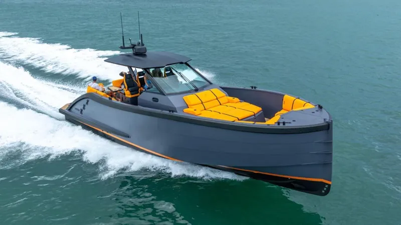  Yacht Photos Pics 2024 Lekker 44 boat cruising on water with sleek design and vibrant orange seating.