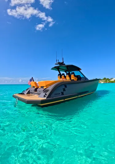  Yacht Photos Pics 2024 Lekker 44 yacht on clear turquoise water under a bright blue sky.