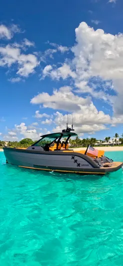  Yacht Photos Pics 2024 Lekker 44 yacht on turquoise water under a clear blue sky.