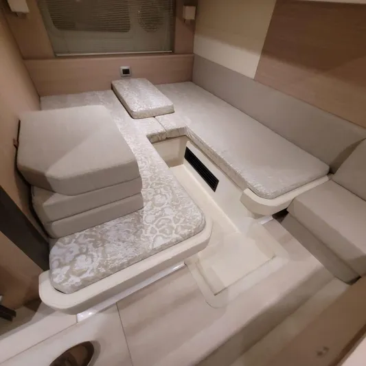  Yacht Photos Pics Interior of 2016 Cranchi Z35 yacht with beige seating and cushions.
