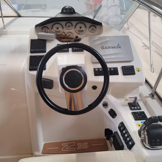  Yacht Photos Pics Cockpit of 2016 Cranchi Z35 yacht with Garmin navigation system and steering wheel.