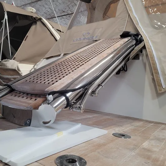  Yacht Photos Pics Cranchi Z35 2016 yacht with a retractable wooden gangway and beige canopy.