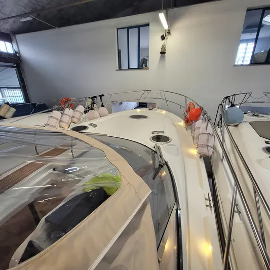  Yacht Photos Pics 2016 Cranchi Z35 yacht in indoor storage, featuring sleek design and safety equipment.