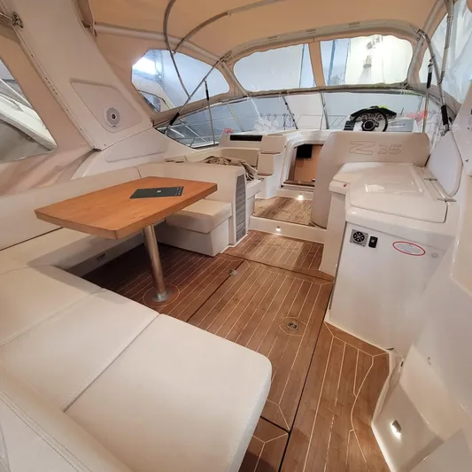  Yacht Photos Pics Interior of 2016 Cranchi Z35 yacht with elegant seating and wooden flooring.