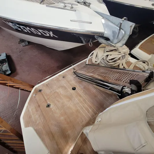  Yacht Photos Pics 2016 Cranchi Z35 boat with wooden deck and folded equipment in storage.