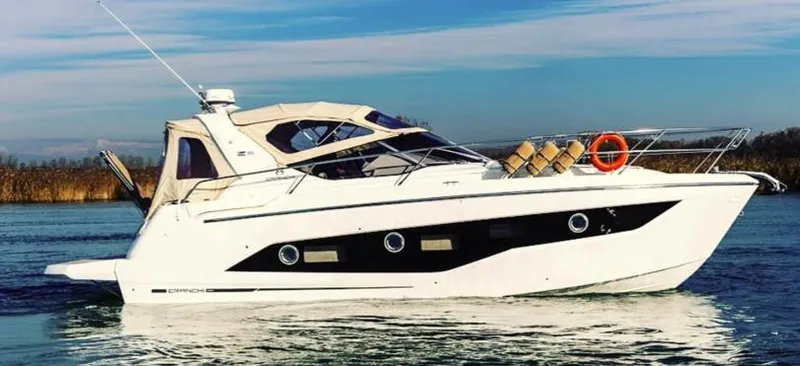  Yacht Photos Pics 2016 Cranchi Z35 yacht on calm water, featuring sleek design and modern amenities.