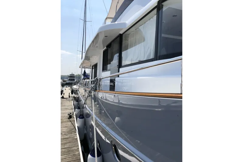  Yacht Photos Pics 2018 Beneteau Swift Trawler 50 docked, showcasing sleek design and modern features.