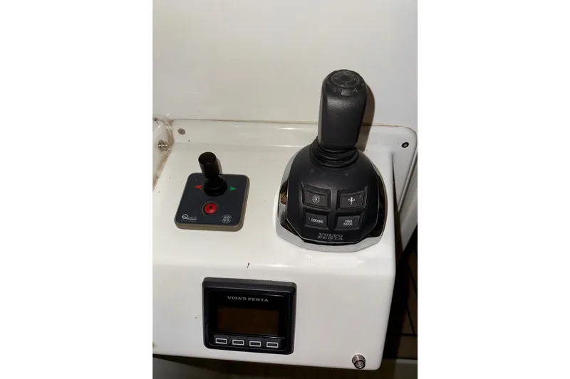  Yacht Photos Pics Control panel of a 2018 Beneteau Swift Trawler 50 with joystick and display.