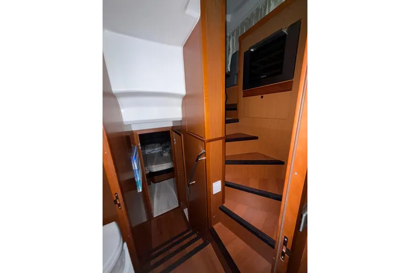  Yacht Photos Pics Interior of 2018 Beneteau Swift Trawler 50, featuring wooden stairs and cabinetry.