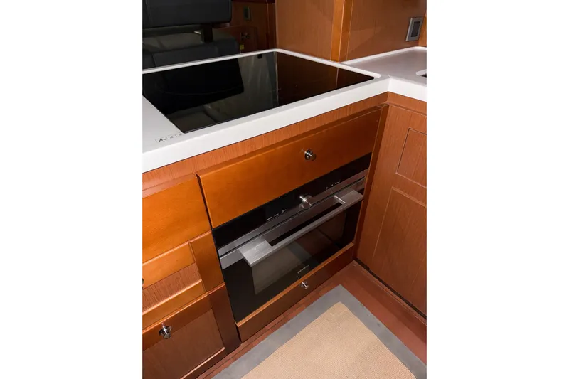  Yacht Photos Pics 2018 Beneteau Swift Trawler 50 kitchen with modern stove and oven.