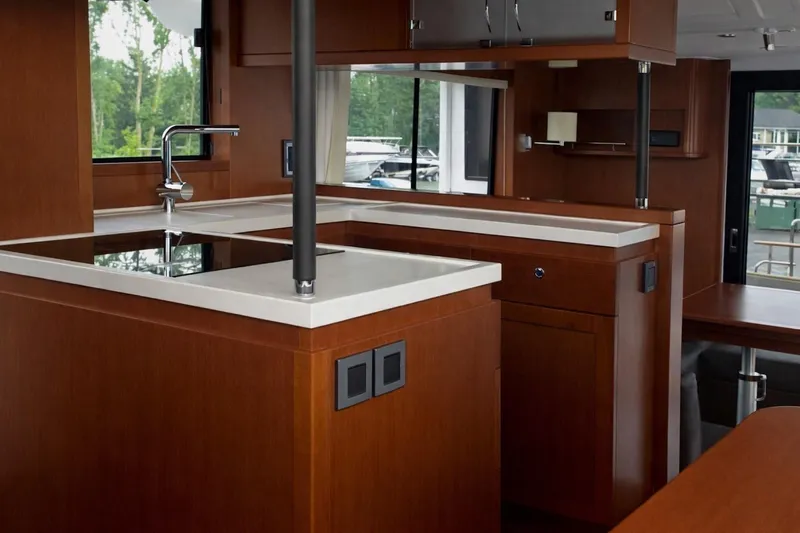  Yacht Photos Pics Luxurious interior of 2018 Beneteau Swift Trawler 50 with modern kitchen design.