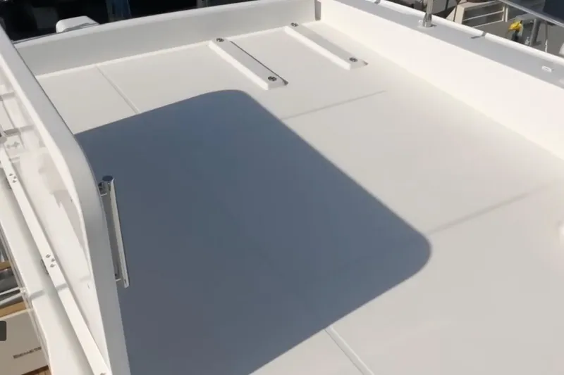  Yacht Photos Pics 2018 Beneteau Swift Trawler 50 deck, featuring sleek white surface and railing.