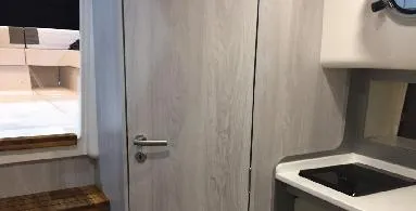 Ready For Immediate Delivery Yacht Photos Pics Interior of 2025 Hanover 387 Outboard Classic Luxury Edition boat, featuring modern kitchenette.