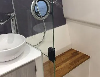 Ready For Immediate Delivery Yacht Photos Pics Luxury bathroom interior of 2025 Hanover 387 Outboard Classic, featuring modern sink and wooden accents.