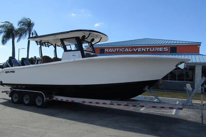  Yacht Photos Pics 2025 Sea Pro 322 Offshore boat on trailer at Nautical Ventures dealership.
