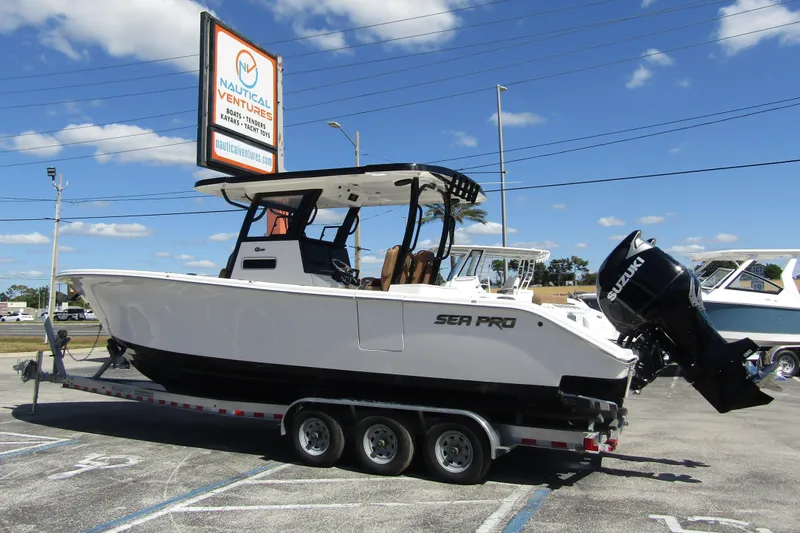  Yacht Photos Pics 2025 Sea Pro 322 Offshore boat on trailer at Nautical Ventures dealership.