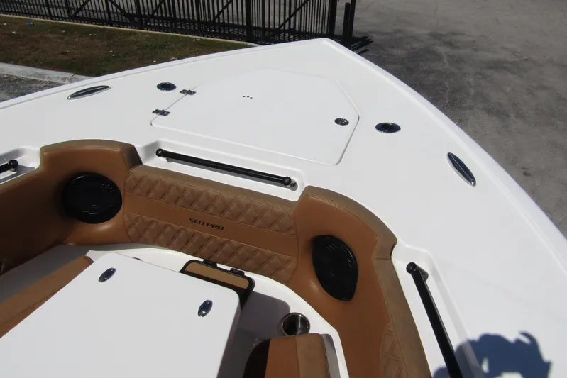  Yacht Photos Pics 2025 Sea Pro 322 Offshore boat interior with tan seating and storage compartments.