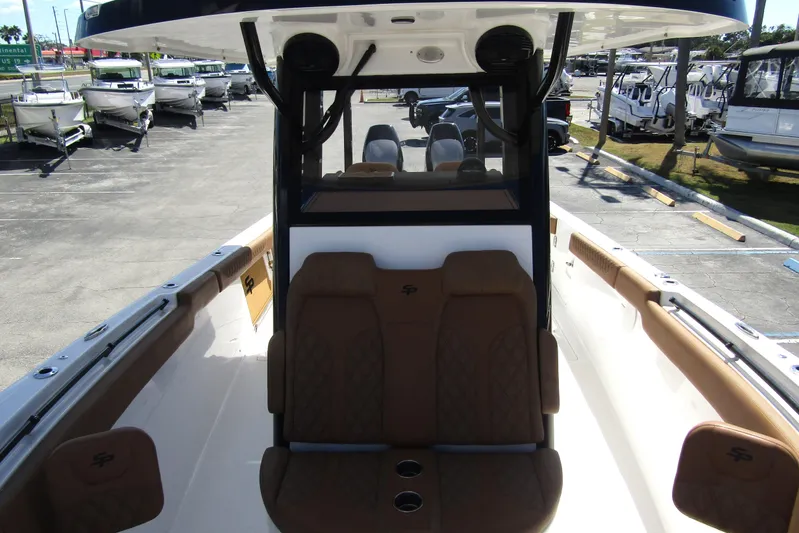  Yacht Photos Pics 2025 Sea Pro 322 Offshore boat interior with brown seating and modern design.