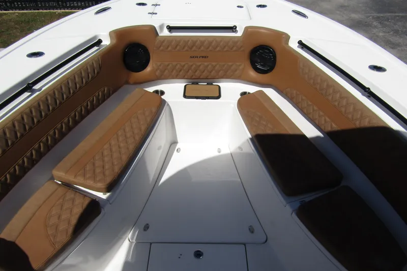  Yacht Photos Pics 2025 Sea Pro 322 Offshore boat interior with brown cushioned seating and white deck.
