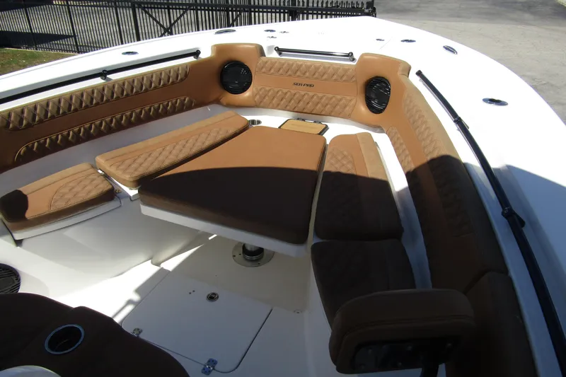  Yacht Photos Pics 2025 Sea Pro 322 Offshore boat interior with brown cushioned seating and table.