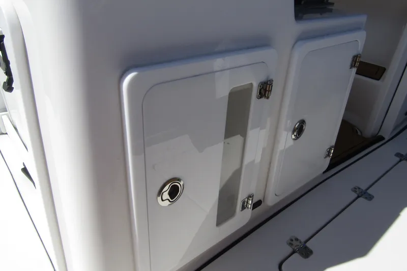  Yacht Photos Pics 2025 Sea Pro 322 Offshore boat storage compartments with sleek white finish.