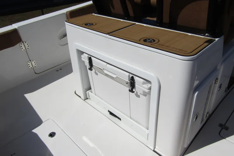  Yacht Photos Pics 2025 Sea Pro 322 Offshore boat interior with storage compartment and seating.