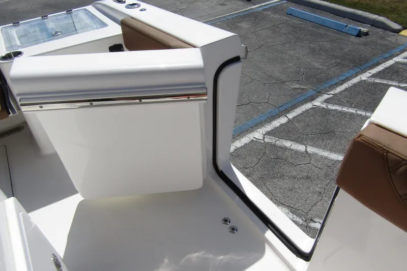  Yacht Photos Pics 2025 Sea Pro 322 Offshore boat interior with seating and storage compartment.
