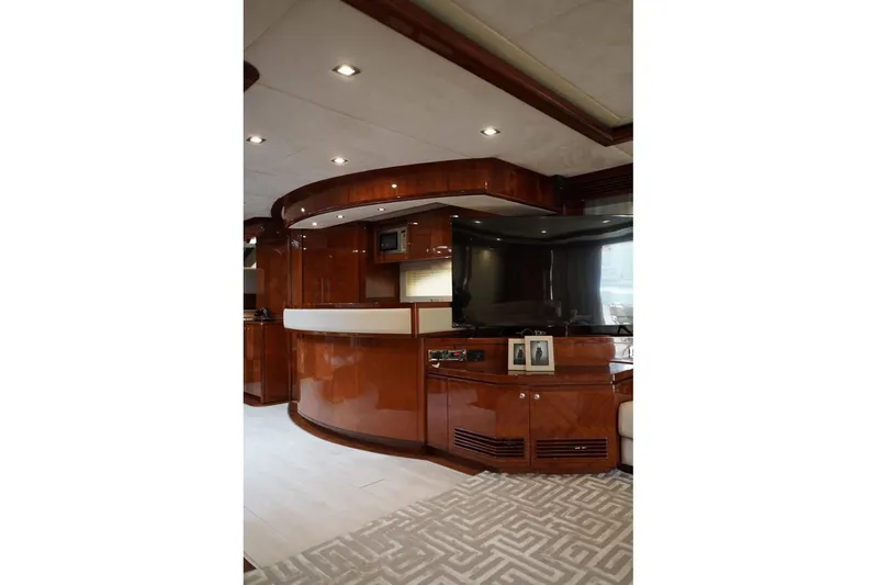  Yacht Photos Pics Luxurious interior of 2013 Gulf Craft Majesty 86 yacht with elegant wood finishes.