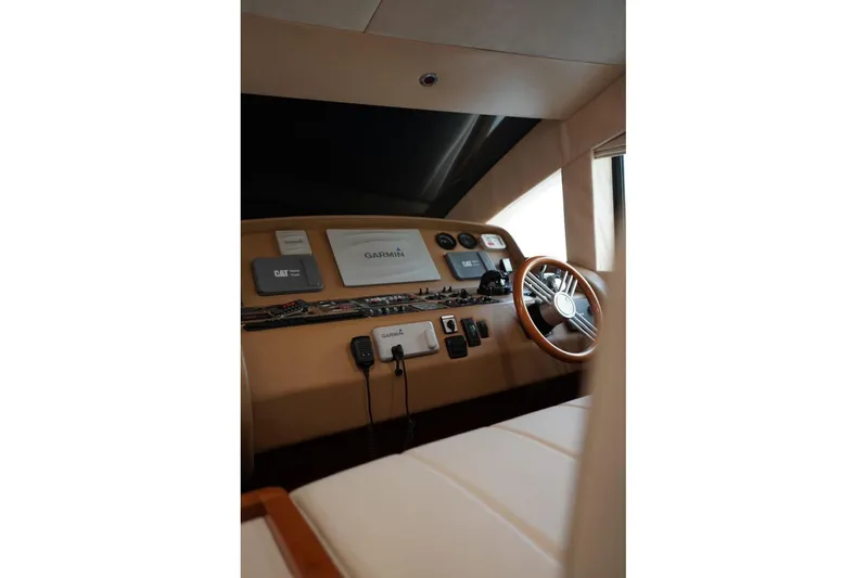  Yacht Photos Pics Interior helm of 2013 Gulf Craft Majesty 86 yacht with navigation equipment.