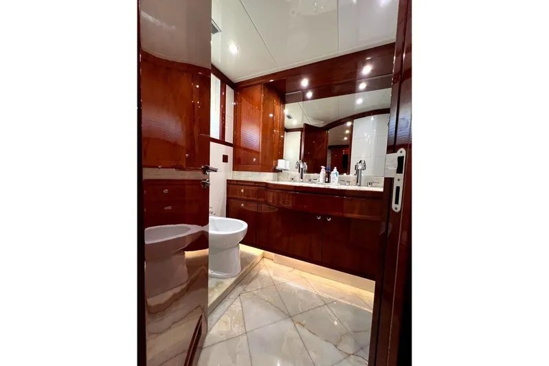  Yacht Photos Pics Luxurious bathroom in 2013 Gulf Craft Majesty 86 yacht with elegant wood finishes.