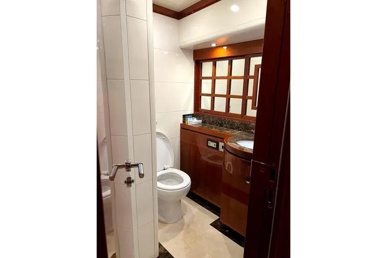  Yacht Photos Pics Luxurious bathroom on 2013 Gulf Craft Majesty 86 yacht with elegant wood and marble finishes.
