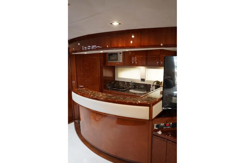  Yacht Photos Pics Luxurious kitchen interior of 2013 Gulf Craft Majesty 86 yacht with wood finish and modern amenities.