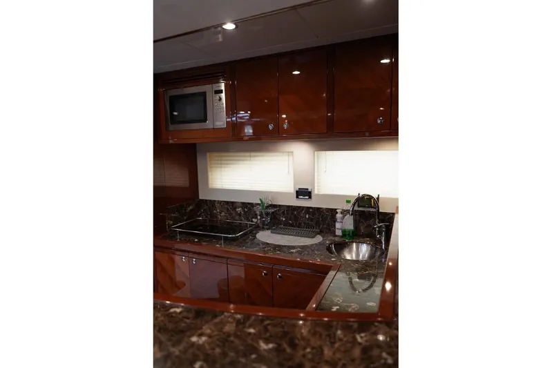  Yacht Photos Pics Luxurious kitchen interior of 2013 Gulf Craft Majesty 86 yacht with modern amenities.